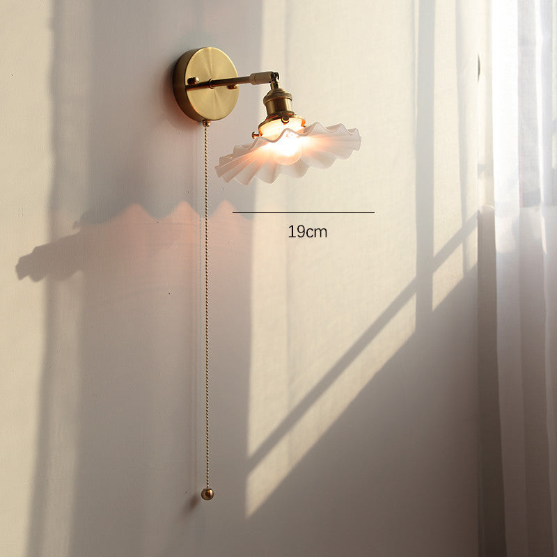 Adjustable Wall Lamp In Front Of Mirror In Bedside